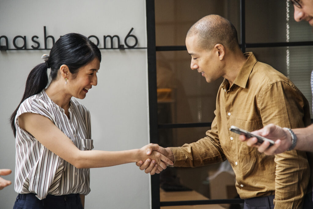 Business people shaking hands in agreement